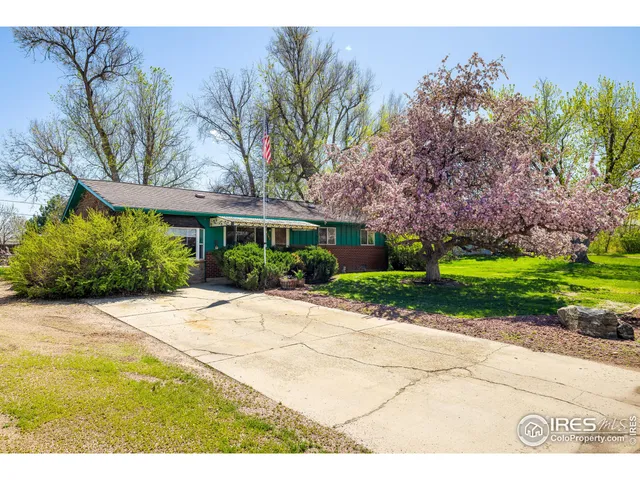 a view of a house with a garden