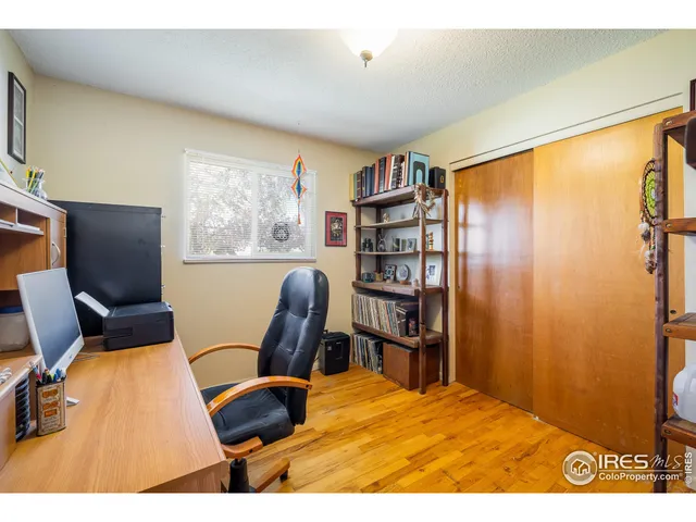 a bedroom with a bed and a table in it