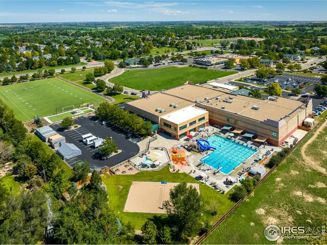 an aerial view of a residential houses with outdoor space