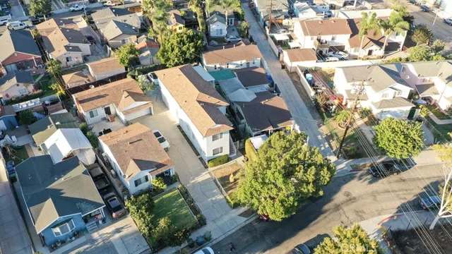 an aerial view of a house with a yard and garden