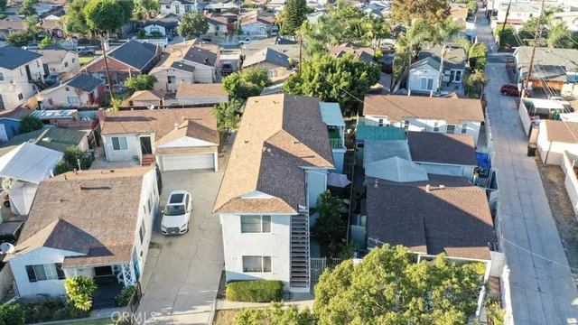 an aerial view of residential houses with outdoor space