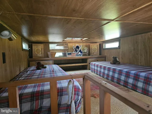 a view of a chairs and table in a balcony