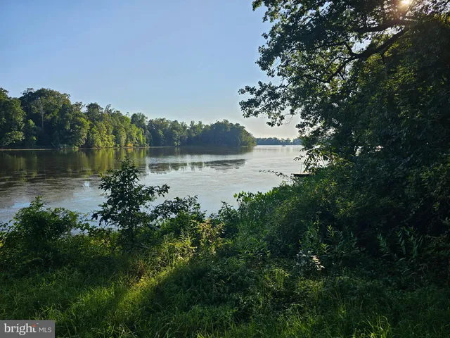a view of lake with green space