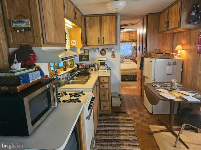 a kitchen with a stove and a refrigerator