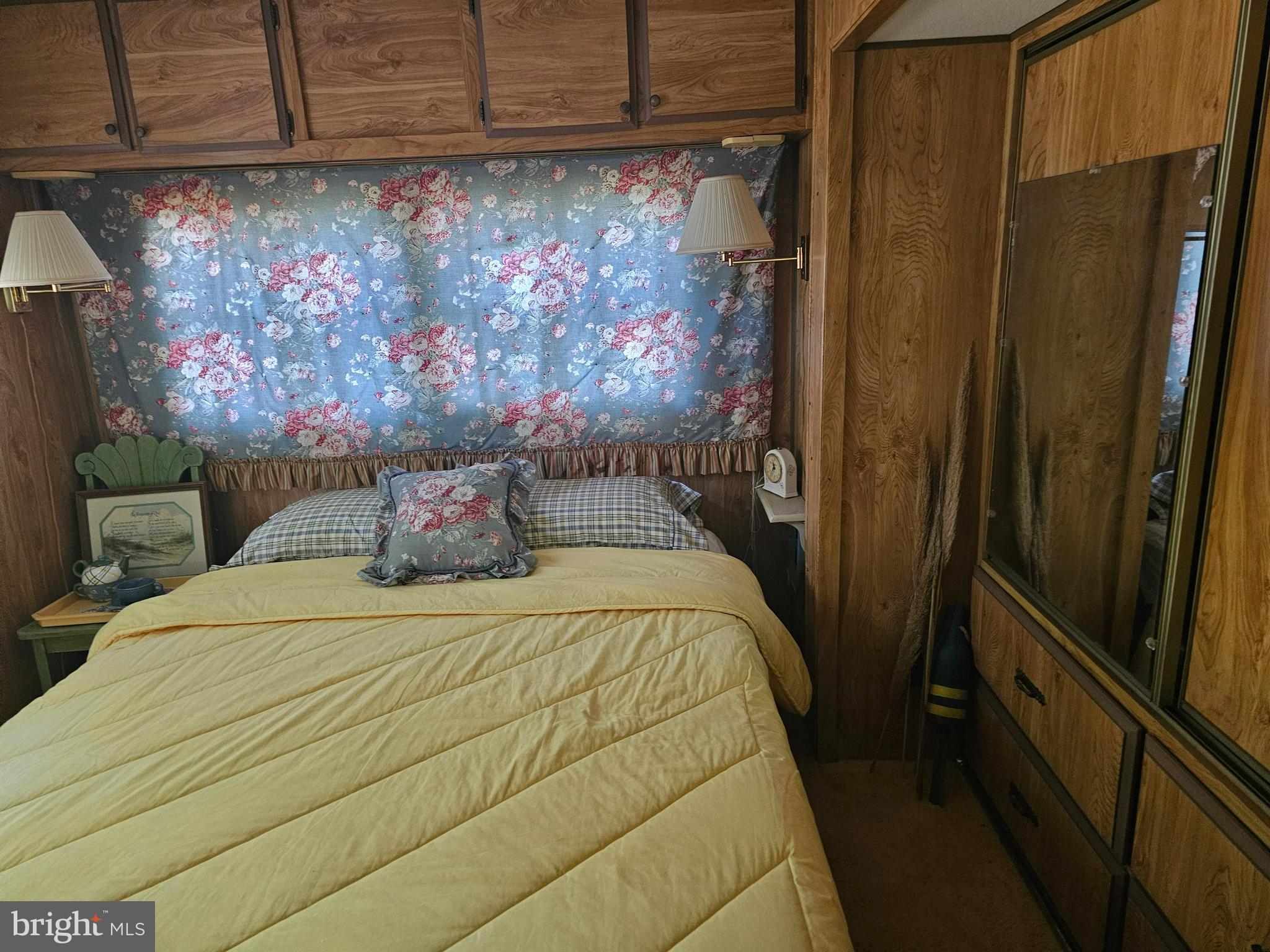 15-16 Hiawatha Drive, Unit GLEN 6 Earleville, MD 21919 - Photo 7 of 11 a bed sitting in a bedroom next to a cabinet