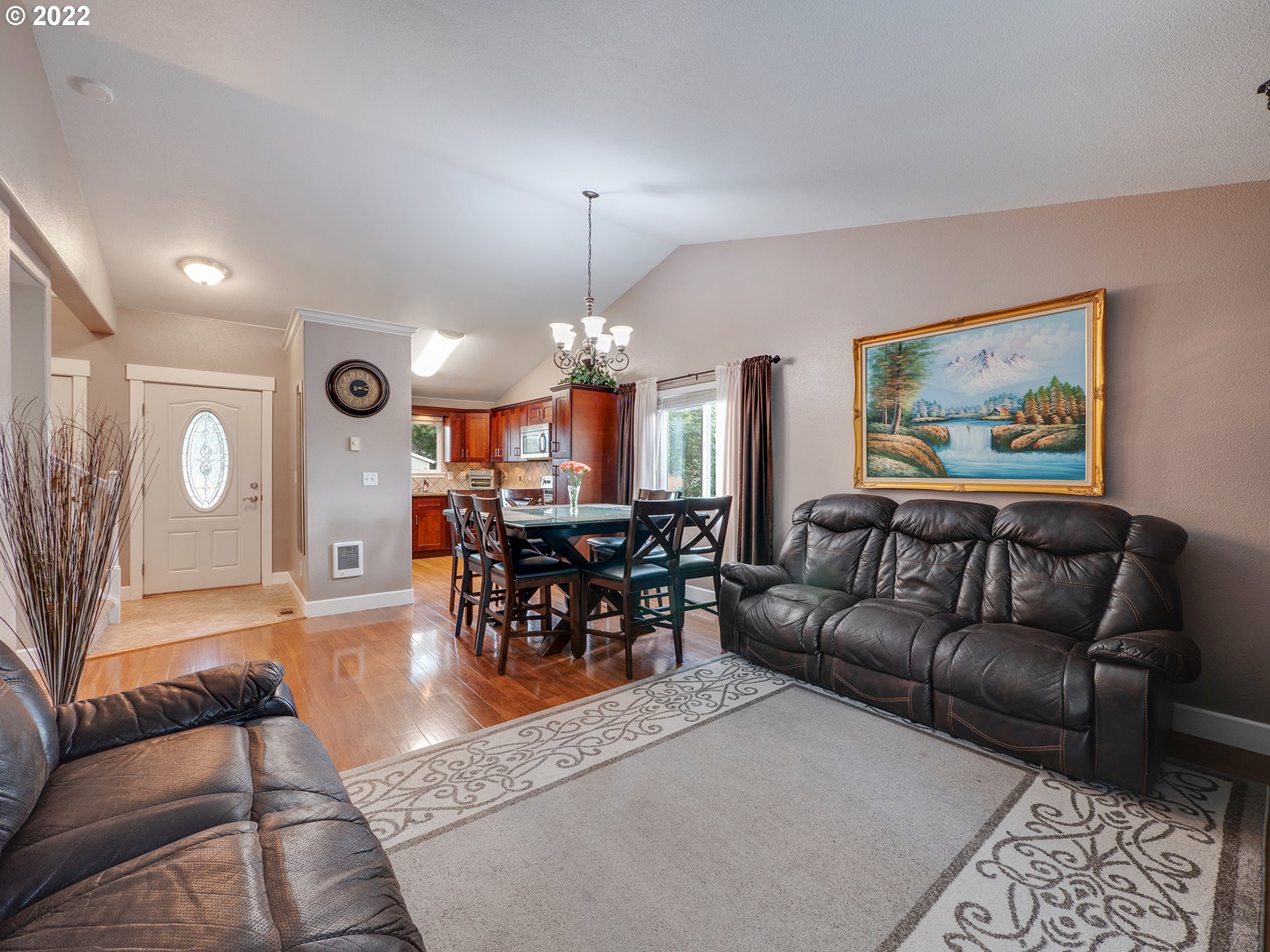 795 Brown Street Woodburn, OR 97071 - Photo 7 of 30 a living room with furniture a chandelier and a dining table