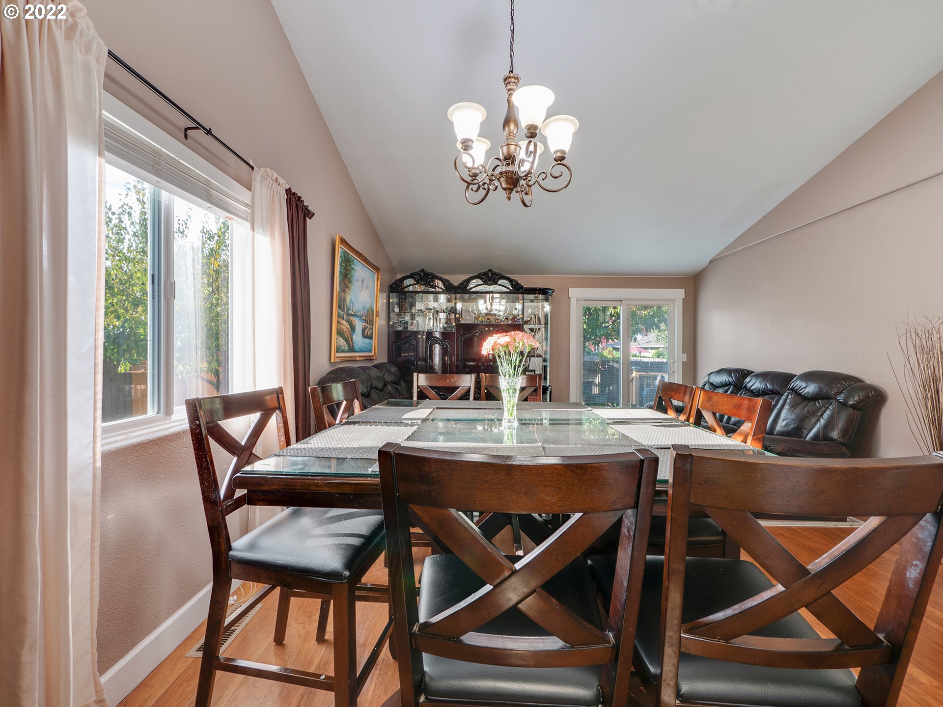 795 Brown Street Woodburn, OR 97071 - Photo 10 of 30 a view of a dining room with furniture a chandelier and wooden floor