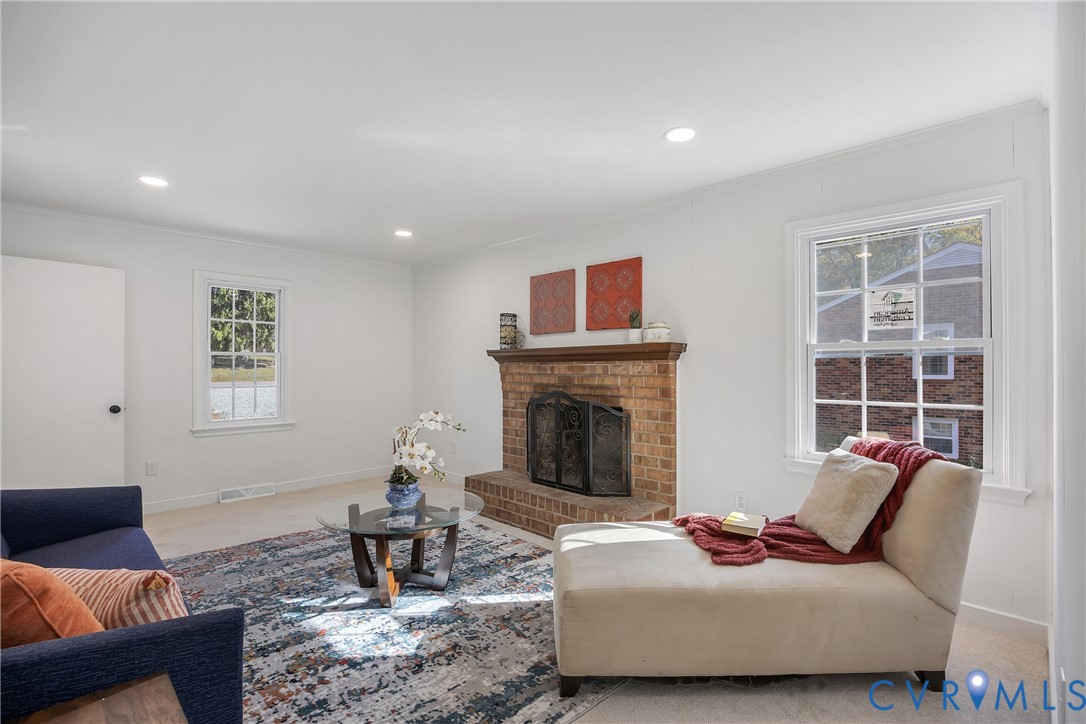 9099 Mossy Brook Road Mechanicsville, VA 23116 - Photo 11 of 29 a living room with furniture and a fireplace