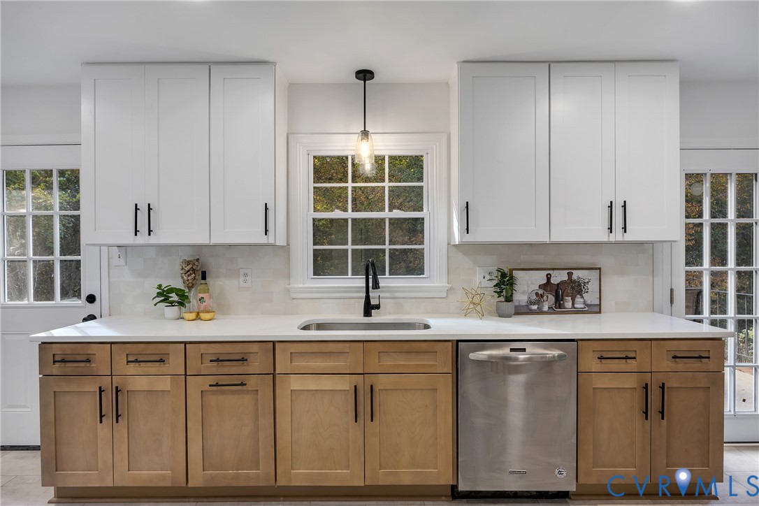 9099 Mossy Brook Road Mechanicsville, VA 23116 - Photo 19 of 29 a kitchen with a sink window and cabinets