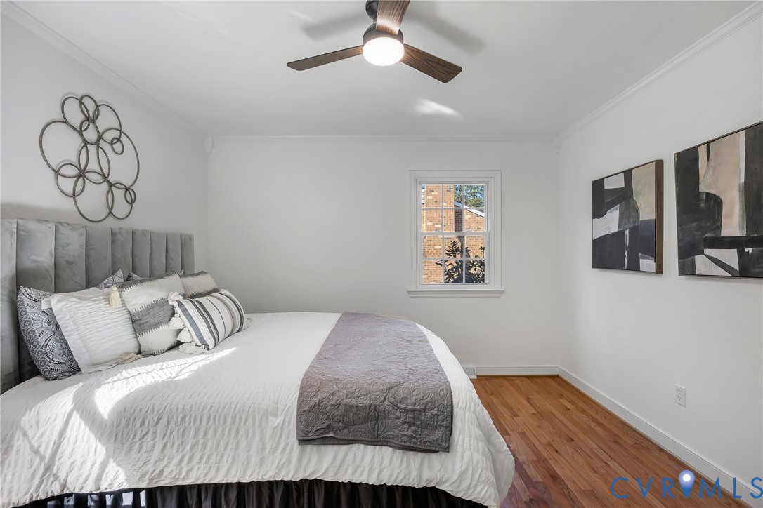 9099 Mossy Brook Road Mechanicsville, VA 23116 - Photo 21 of 29 a bedroom with a bed and painting on the wall