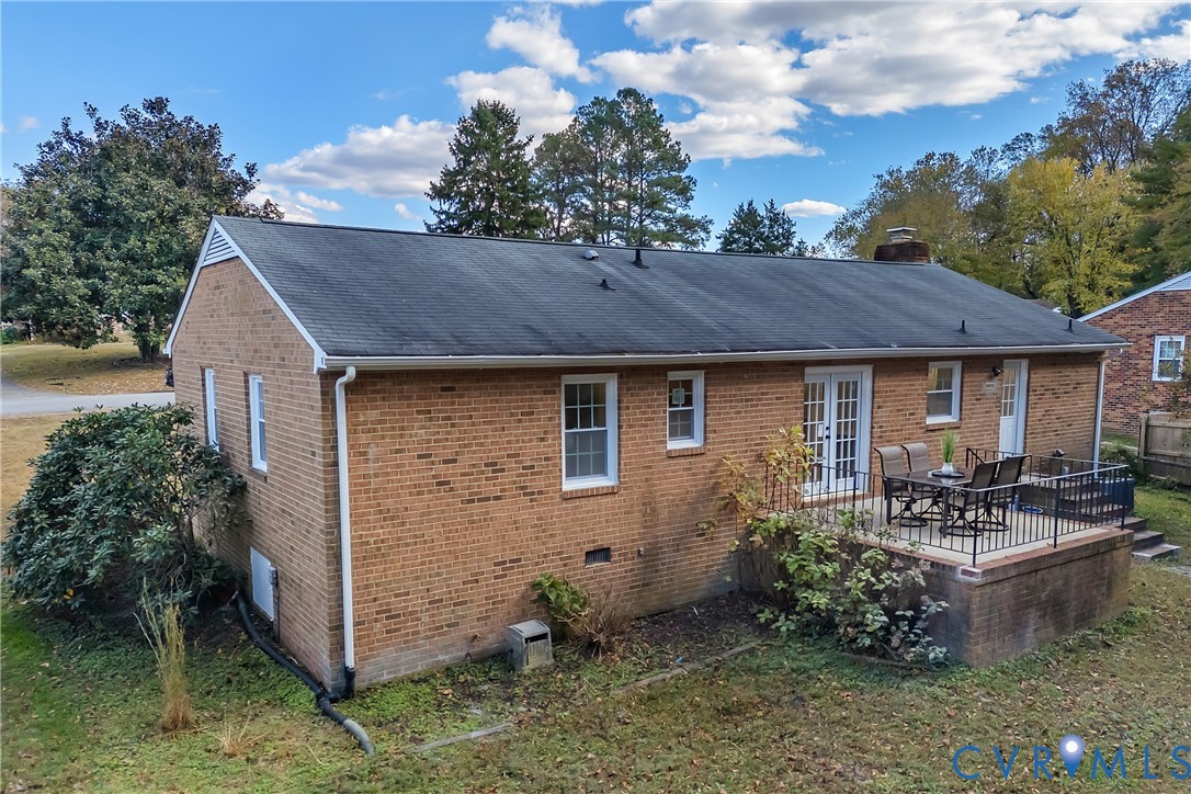 9099 Mossy Brook Road Mechanicsville, VA 23116 - Photo 28 of 29 a backyard of a house with yard barbeque oven and outdoor seating