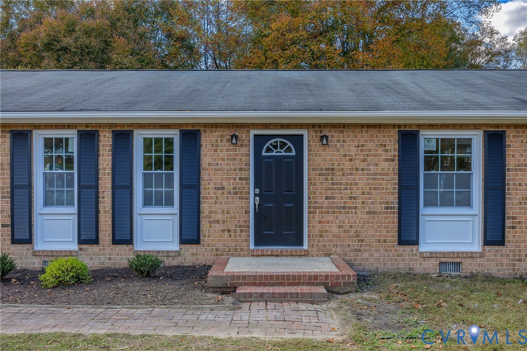 9099 Mossy Brook Road Mechanicsville, VA 23116 - Photo 4 of 29 a front view of a house with garden
