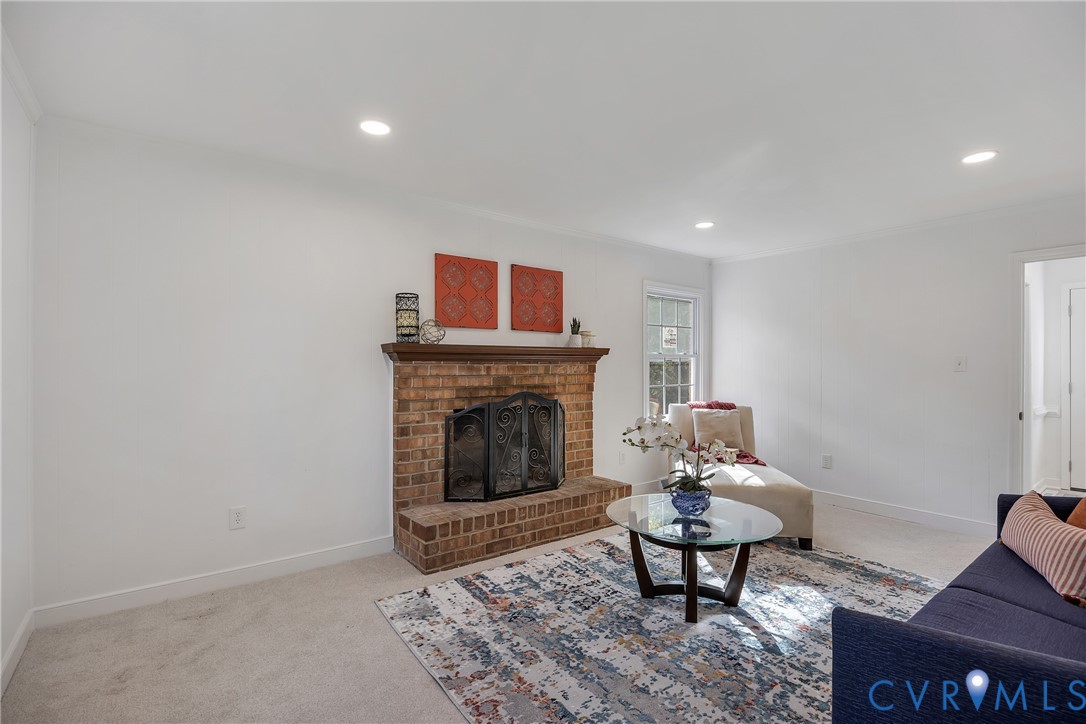 9099 Mossy Brook Road Mechanicsville, VA 23116 - Photo 8 of 29 a living room with furniture and a fireplace