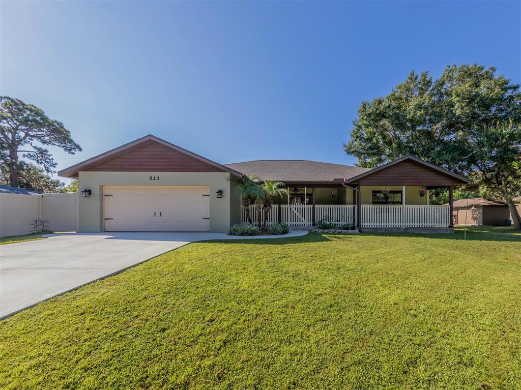 523 Brown Road Venice, FL 34293 - Photo 1 of 1 Relax on the beautiful covered front porch.