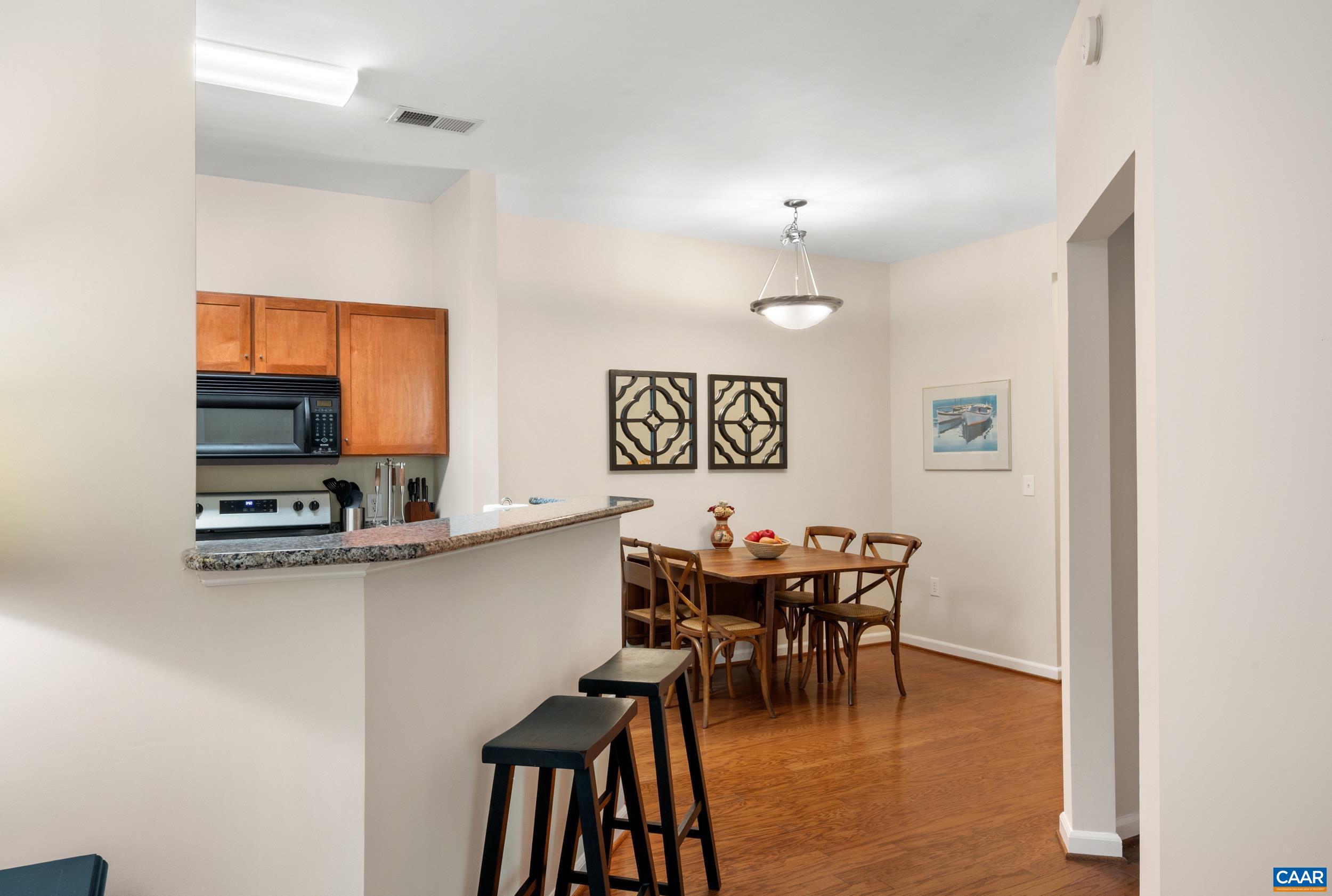 765 Walker Square, Unit 2D Charlottesville, VA 22903 - Photo 11 of 33 a view of a dining room with furniture