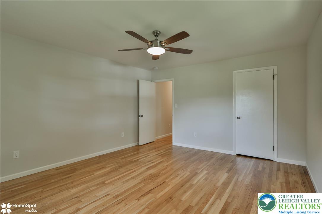 919 Point Phillips Road Bath, PA 18014 - Photo 32 of 59 Hardwood flooring extends throughout this naturally illuminated bedroom, complemented by a convenient ceiling fan.