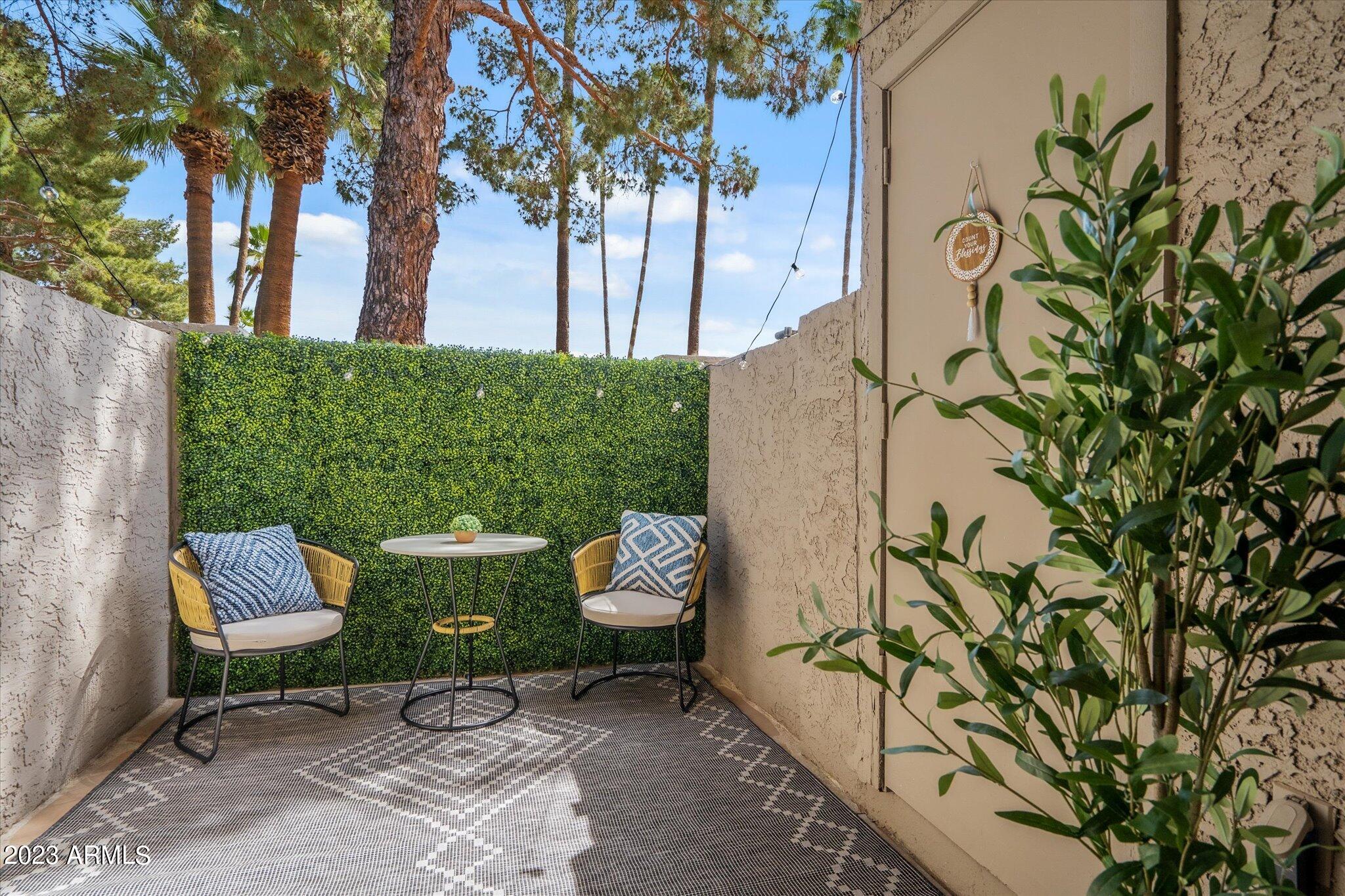 533 West Guadalupe Road, Unit 1024 Mesa, AZ 85210 - Photo 51 of 60 a view of a backyard with chairs