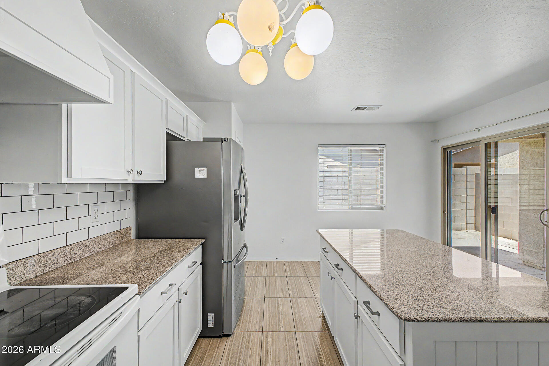 1882 West Rd Agent Street Apache Junction, AZ 85120 - Photo 9 of 26 a kitchen with cabinets and window