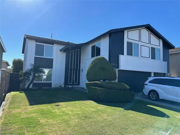 a front view of a house with garage
