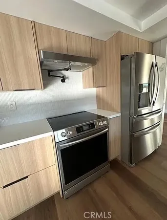 a living room with a couch and a dresser