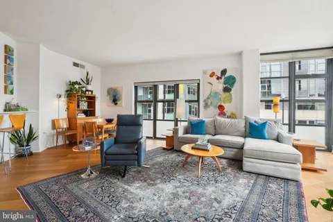 a living room with furniture and a rug