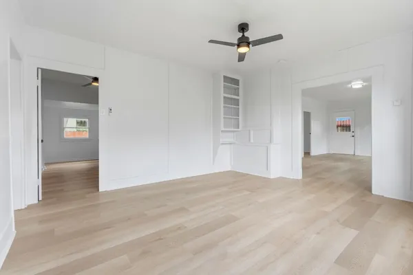 a view of an empty room with a bathroom