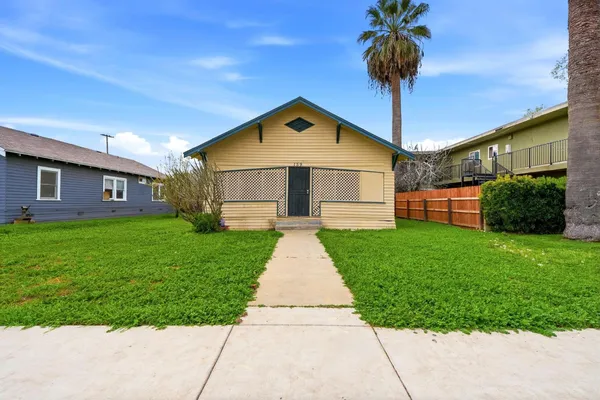 a front view of a house with garden