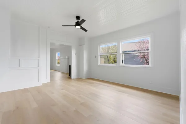 a view of an empty room with a window