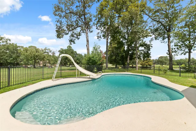 a view of a swimming pool with a sitting area