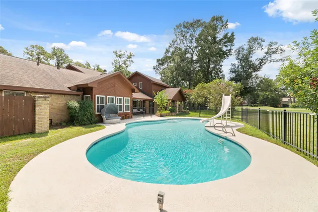 a view of a swimming pool with a patio