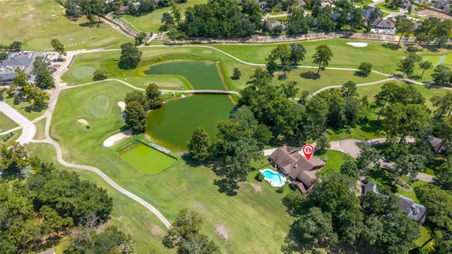 view of a golf course with a building in the background