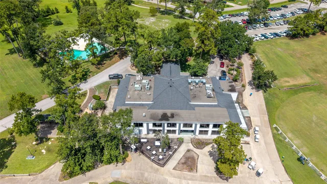 an aerial view of multiple houses with yard