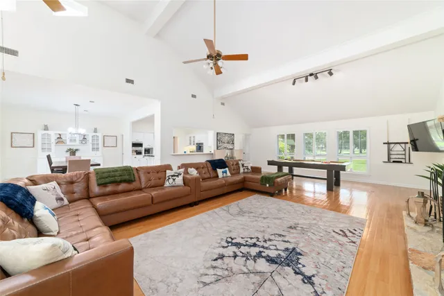 a view of a living room filled with furniture
