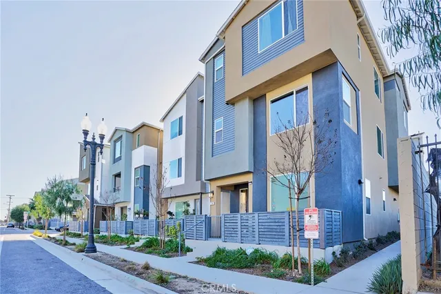 a view of a brick house with many windows