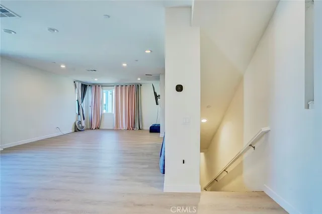 a view of a livingroom with workspace and a window