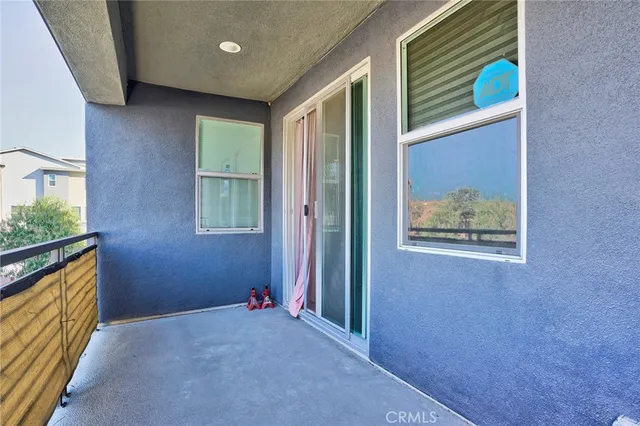 a bathroom with a granite countertop toilet and sink