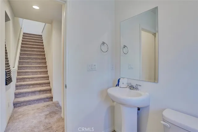 a view of room with wooden floor and furniture