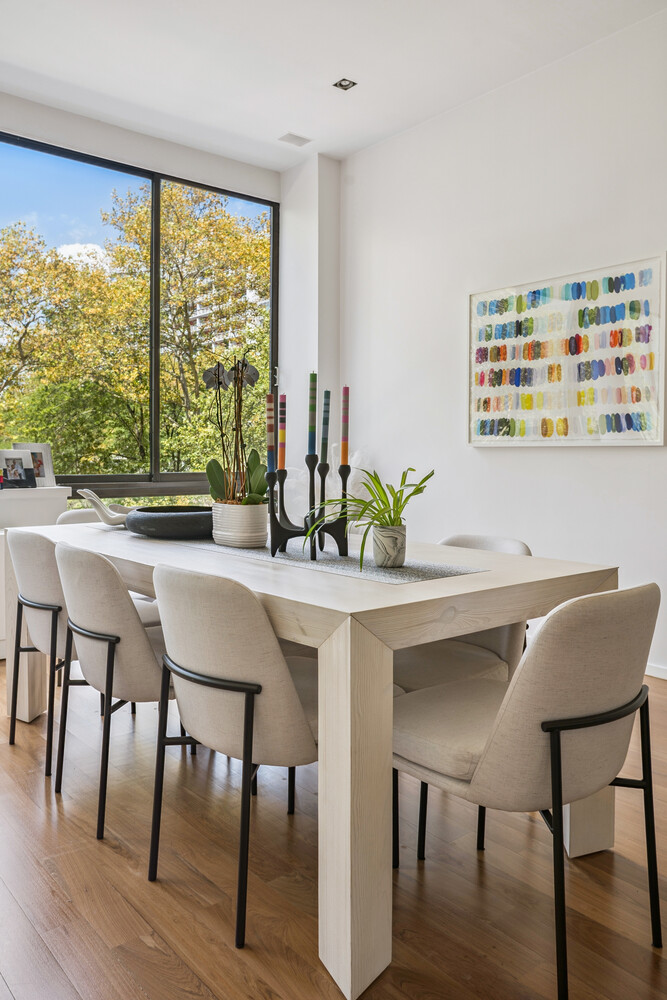 77 Bleecker Street, Unit 307 Manhattan, NY 10012 - Photo 3 of 14 a view of a dining room with furniture and wooden floor