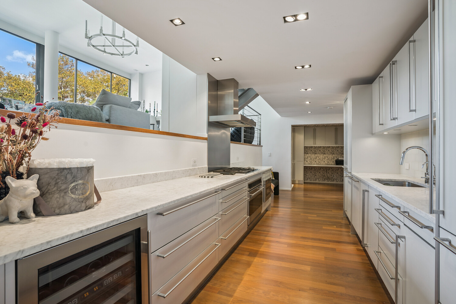 77 Bleecker Street, Unit 307 Manhattan, NY 10012 - Photo 4 of 14 a kitchen with granite countertop a sink and cabinets