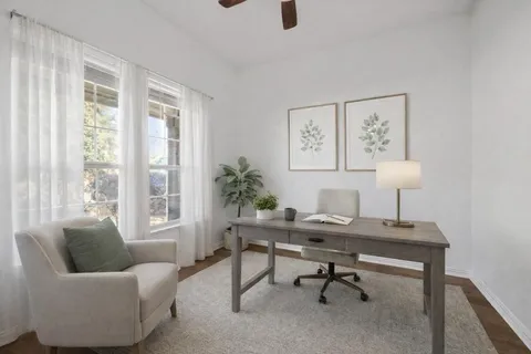 a workspace with furniture and a window