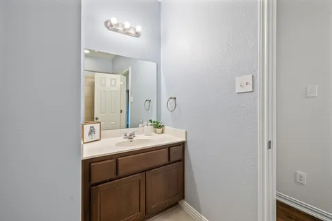 a bedroom with a bed and a desk