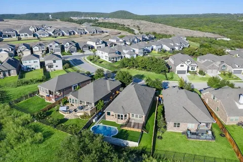 an aerial view of residential building and green space