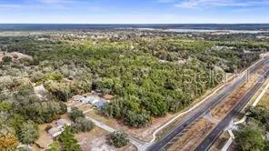 a view of a yard with wooden fence