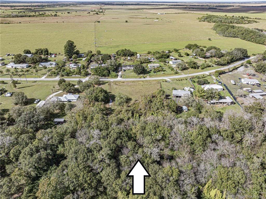 17510 Northwest 38th Avenue Okeechobee, FL 34972 - Photo 3 of 11 a aerial view of ocean with residential house and ocean view