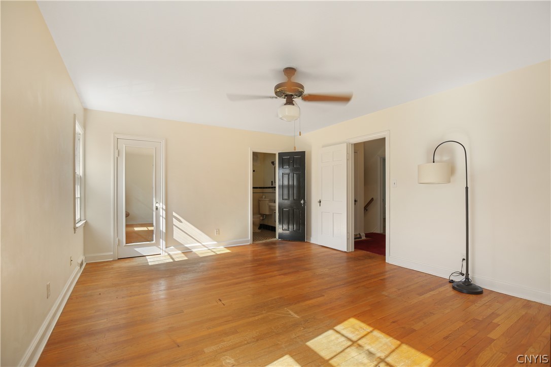 314 Deforest Road Syracuse, NY 13214 - Photo 24 of 40 ... with a walk-in closet on the left and the ensuite bathroom showing through the middle doorway.