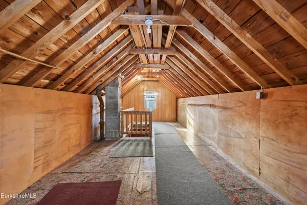 a view of a room with wooden walls