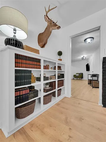 a living room with furniture and a mirror