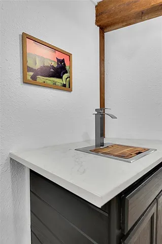 a room with a dresser and a mirror