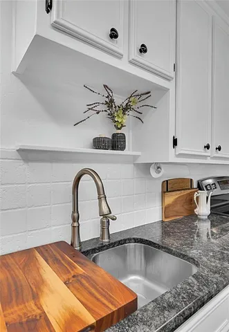 a stove top oven sitting inside of a kitchen