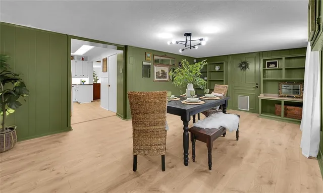 a view of a dining room with furniture and window